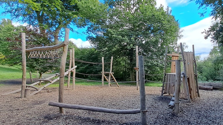 Wild play area wooden climbing frame at Emmetts Garden